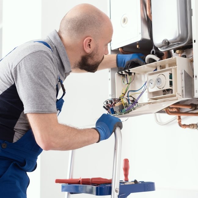 Professional,Boiler,Service:,Qualified,Technician,Checking,A,Natural,Gas,Boiler